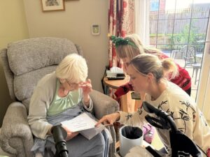 Residents and team members sit around enjoying each others company at Cavendish Park in Evesham.