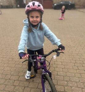 A Majesticare-Kid on a bike.